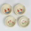Selection of stoneware pottery Children's Bowls in multiple glazes and hand-painted designs.