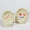 Selection of stoneware pottery Children's Bowls in multiple glazes and hand-painted designs.