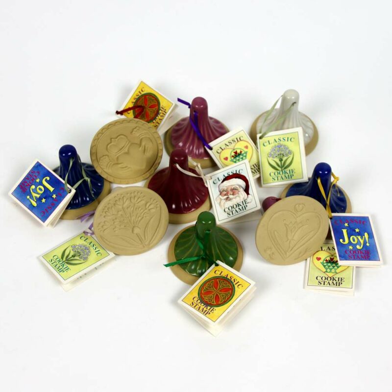 Selection of stoneware pottery Cookie Stamps in multiple glazed handles and stamp designs.
