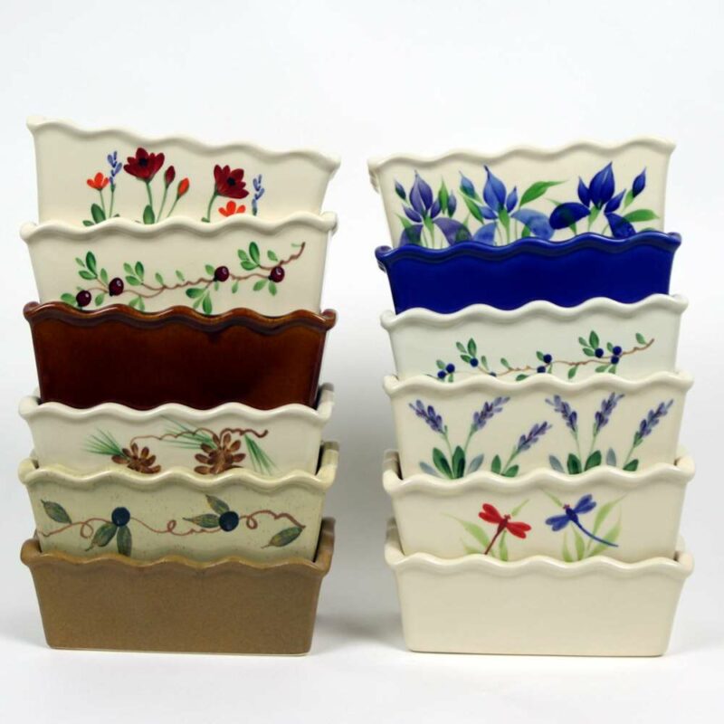 Selection of stoneware pottery Large Loaf Pans in multiple glazes and hand-painted designs.
