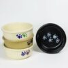 Selection of stoneware pottery Large Walking Paws Pet Bowls in multiple glazes and hand-painted designs.