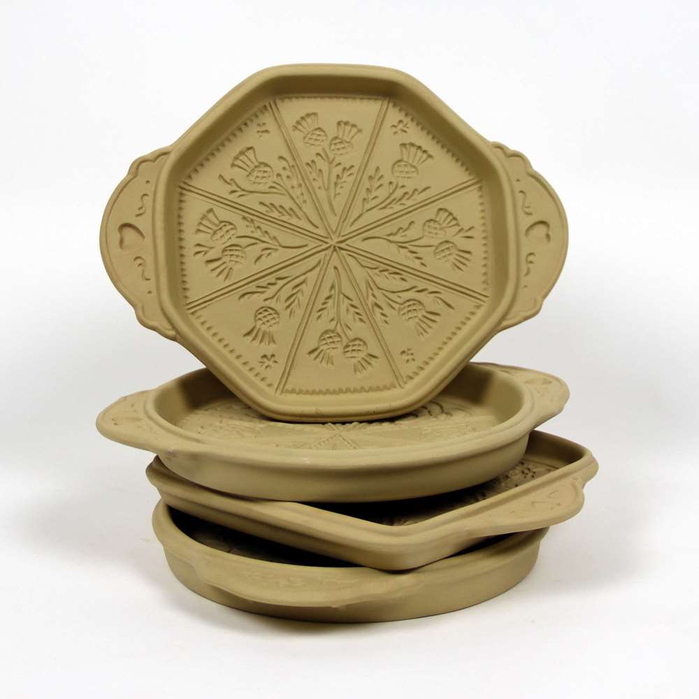 Selection of stoneware pottery Shortbread Pans in multiple shapes and shortbread designs.