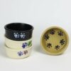 Selection of stoneware pottery Small Walking Paws Pet Bowls in multiple glazes and hand-painted designs.