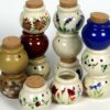 Selection of stoneware pottery Storage Jars in multiple glazes and hand-painted designs.
