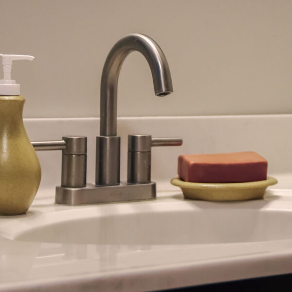 Go Green Earthware soap dish and lotion bottle help reduce plastic waste