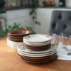 Pinecone and Copper Clay Classic Dinnerware with glasses.